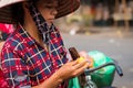 Fruit seller is slicing a fruit