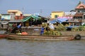 Fruit sellers loading pineapples from at the floating market in Can Tho, Vietnam Royalty Free Stock Photo