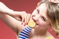 Fruit Series. Portrait of Passionate Caucasian Blond Biting Lemon