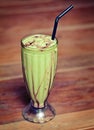 Fruit shake in a glass on the table - exotic drink. Royalty Free Stock Photo