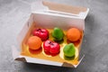 fruit-shaped mousse cakes in a box
