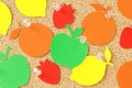 Fruit shaped paper note on pinboard