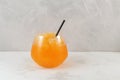 Glass of Orange Granizado or Orange Slushie drink with natural juice. Fruit shaved ice. Royalty Free Stock Photo