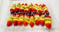 fruit skewer with kiwi, melon, raspberry, strawberry, pineapple and assorted fruits