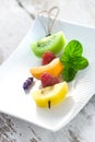 Fruit skewer on a white platter