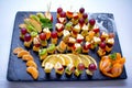 Fruit skewers - fresh apple, kiwi, lemon slices, tangerine, grapes and cheese Royalty Free Stock Photo