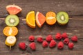 Fruit skewers on the wooden background Royalty Free Stock Photo