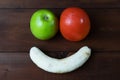 Fruit smiley on wooden background Royalty Free Stock Photo