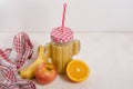 Fruit smoothie made from fresh ingredients from apple, banana, orange on a white wooden background with copy space. Healthy eating Royalty Free Stock Photo