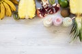 Fruit smoothies in glass bottles with ingredients on white wooden table, top view. Flat lay. From above, overhead. Royalty Free Stock Photo