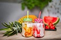 Fruit smoothies in glass jars with straws. Strawberry Royalty Free Stock Photo