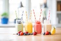 fruit smoothies in mason jars with straws Royalty Free Stock Photo