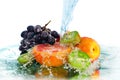Fruit in a spray of water Royalty Free Stock Photo