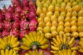 Fruit stable with beautiful ripe fruits, mangos, dragon fruits and bananas on rainy day in Hoi An, Vietnam, Asia