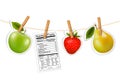 Fruit stickers and a nutrition label hanging on a rope. Royalty Free Stock Photo