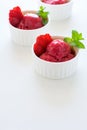 Fruit strawberry sorbet with mint in bowl on white wooden background Royalty Free Stock Photo