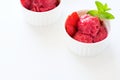 Fruit strawberry sorbet with mint in bowl on white wooden background Royalty Free Stock Photo