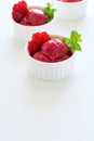 Fruit strawberry sorbet with mint in bowl on white wooden background Royalty Free Stock Photo