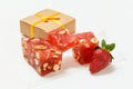 Fruit sweets with nuts and gift box on white background Royalty Free Stock Photo