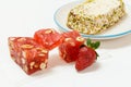 Fruit sweets with nuts and halva on white background.