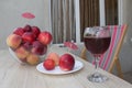 Fruit on the table. Peaches, nectarine, plums. A glass of red wine Royalty Free Stock Photo