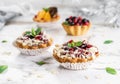 Fruit tart with berries, almond and cream, cakes and sweetness on light marble background. Delicious dessert and candy bar