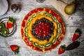 Fruit tart cake on white wooden background Royalty Free Stock Photo