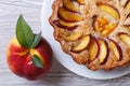 Fruit tart and fresh peach closeup top view Royalty Free Stock Photo