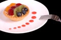 Fruit tart with strawberry sauce Royalty Free Stock Photo