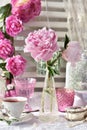 Fruit tea in beautiful porcelain cup and peony flowers