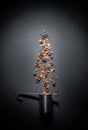 Fruit tea of dried flowers petals and dry berries with strainer or infuser- filter isolated on gray black background Royalty Free Stock Photo