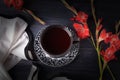 Fruit tea and red gladiolus flowers on a black background. Top view Royalty Free Stock Photo