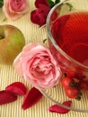 Fruit tea with rose hips, apples and rose flowers Royalty Free Stock Photo