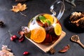 Fruit tea. Seasonal winter autumn hot drink. Citrus and berry tea with lemon, oranges  and mint Royalty Free Stock Photo