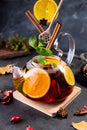 Fruit tea. Seasonal winter autumn hot drink. Citrus and berry tea with lemon, oranges  and mint Royalty Free Stock Photo