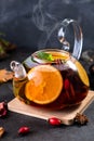 Fruit tea. Seasonal winter autumn hot drink. Citrus and berry tea with lemon, oranges  and mint Royalty Free Stock Photo