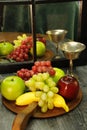 Fruit tray, silver wine glass with reflection through mirrored window Royalty Free Stock Photo