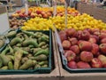 Fruit in a tray in the store. Apples, pears, kiwi, lemons and oranges in assortment