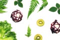 Fruit and vegetable background, Colorful pattern made of kiwi fruits, purple cabbage and green leaves.