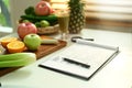 Fruit and vegetable on chopping board with Nutrition Facts on table. Royalty Free Stock Photo