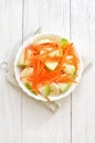 Fruit vegetable salad with carrots, apples, bananas, top view Royalty Free Stock Photo