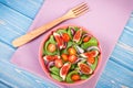 Fruit and vegetable salad with wooden fork, concept of healthy lifestyle and nutrition Royalty Free Stock Photo