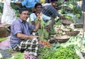 A fruit and vegetable seller at a roadside market near Mirissa on the south coast of Sri Lanka.