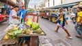 A fruit vendor on a busy Manila street.