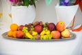 Fruit on on white. Dessert on a platter. Royalty Free Stock Photo