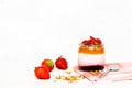 Fruit yogurt berry with muesli and fresh strawberries, on a white wooden background Royalty Free Stock Photo