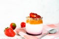 Fruit yogurt berry with muesli and fresh strawberries, on a white wooden background Royalty Free Stock Photo