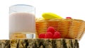 Fruit yogurt isolated on white background fruit in a basket, raspberry yogurt in a glass, close-up