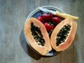 Fruitarian lunch papaya and strawberries fresh fruit