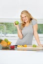 Fruits, apple or portrait of happy girl for healthy lunch or breakfast meal or diet in kitchen at home. Morning snack Royalty Free Stock Photo